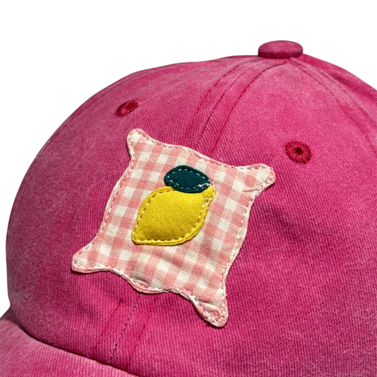 Casquette rose fuschia à motif citron