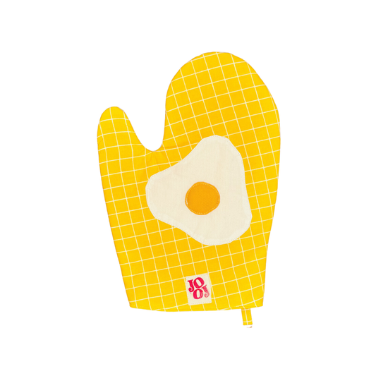 Ensemble manique + gant œuf au plat sur fond jaune à carreaux