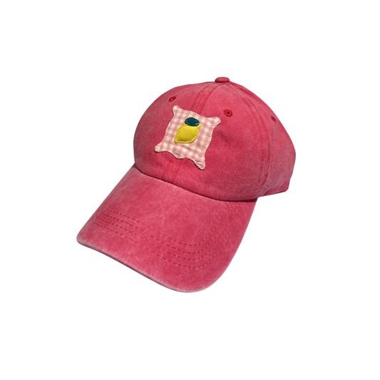 Casquette rose fuschia à motif citron