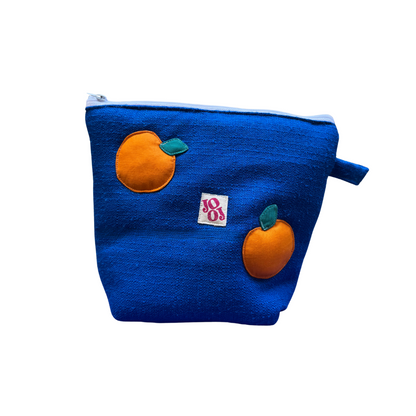 Troussass de toilette bleu avec oranges