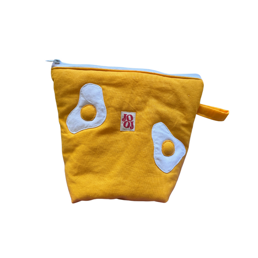 Troussass de toilette jaune avec œufs au plat