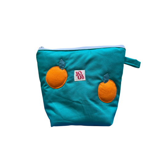 Troussass de toilette verte avec oranges
