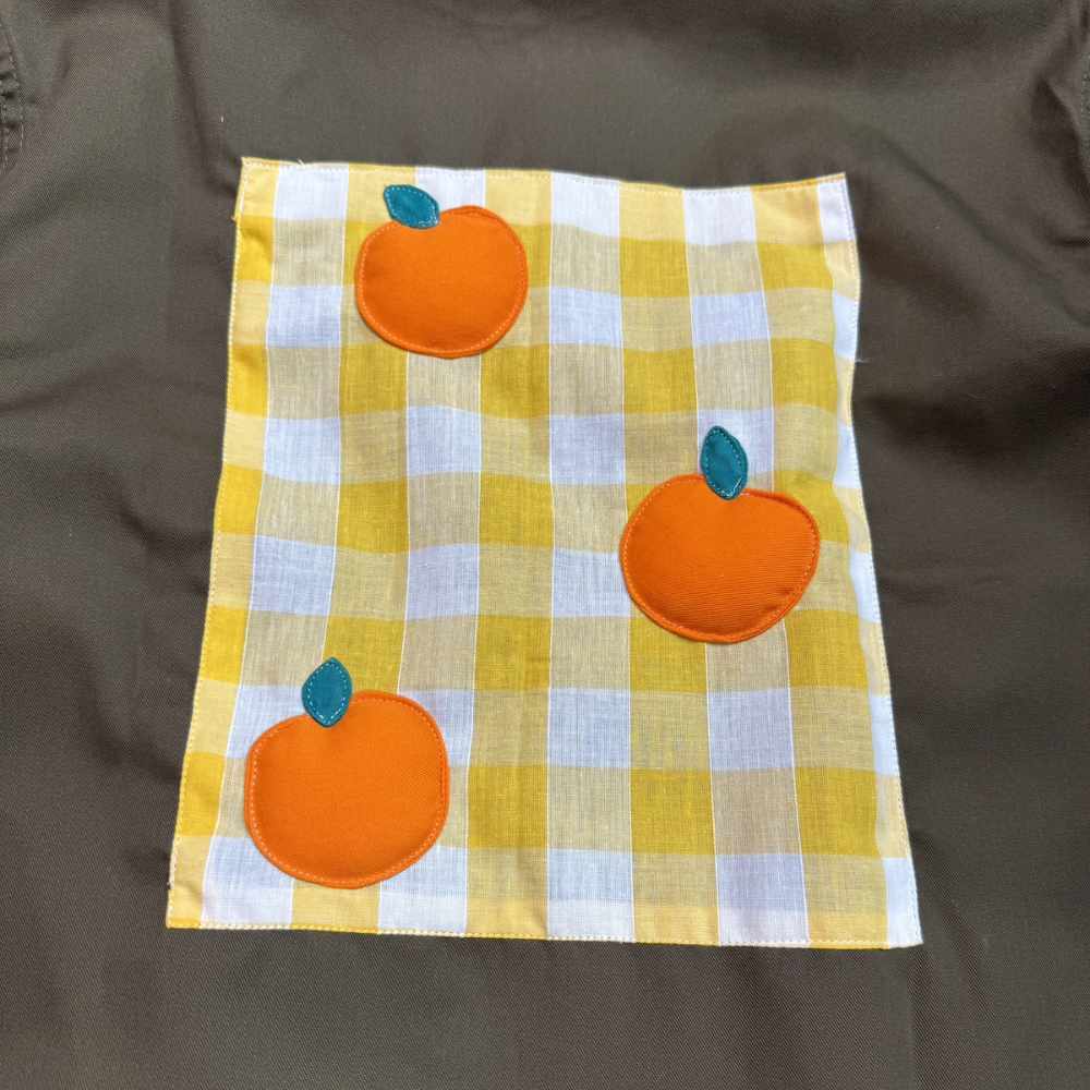 Veste marron à motif vichy jaune et oranges 3D